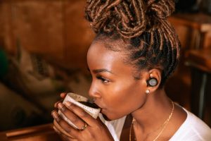 jbl tour pro tws lifestyle image noise cancelling cafe